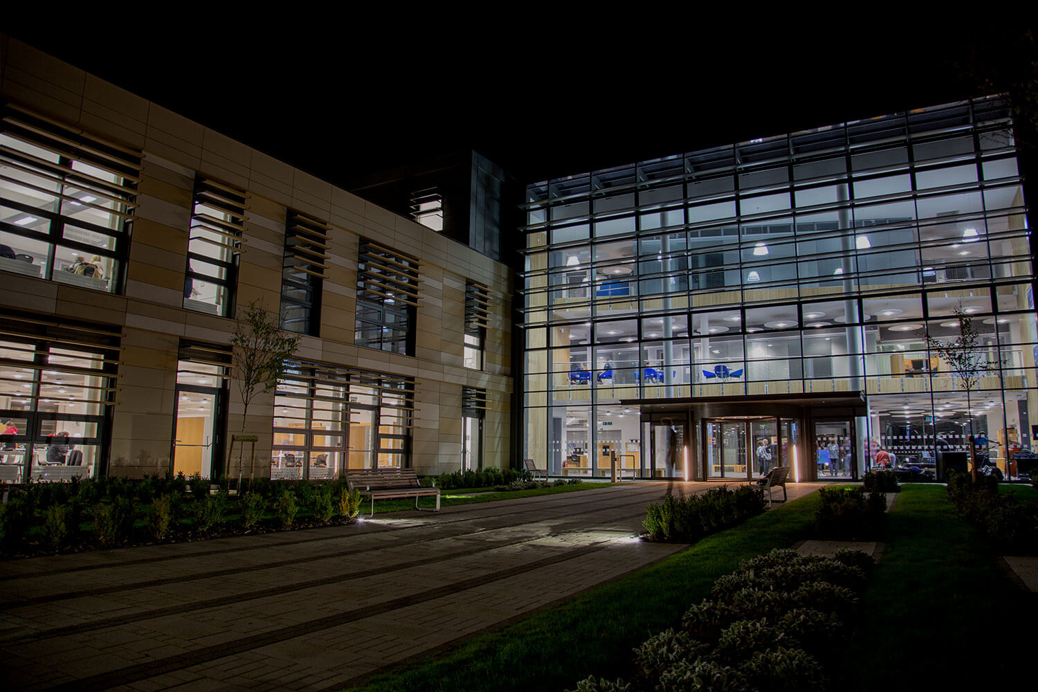 Front of the Commons building at night