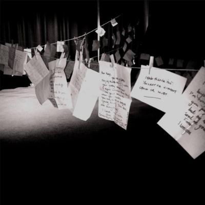 Handwritten letters pegged out on a string