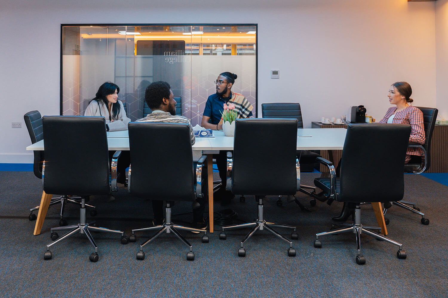 A group of students in a conference room