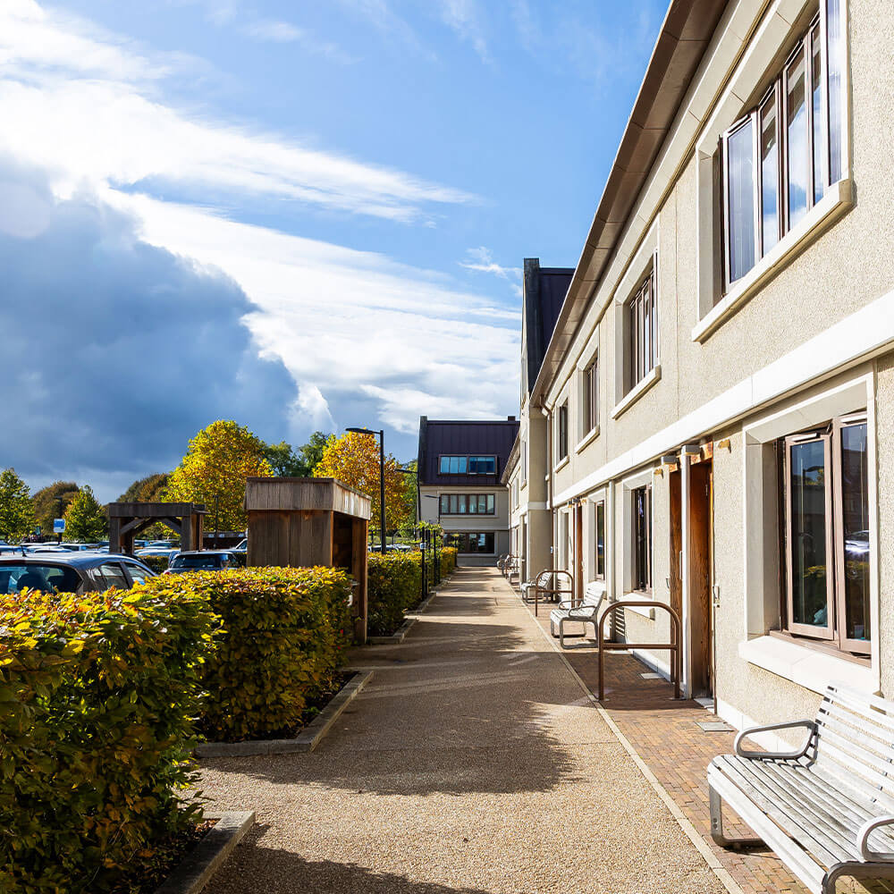 The exterior of Gardens accommodation at Newton Park on a sunny day