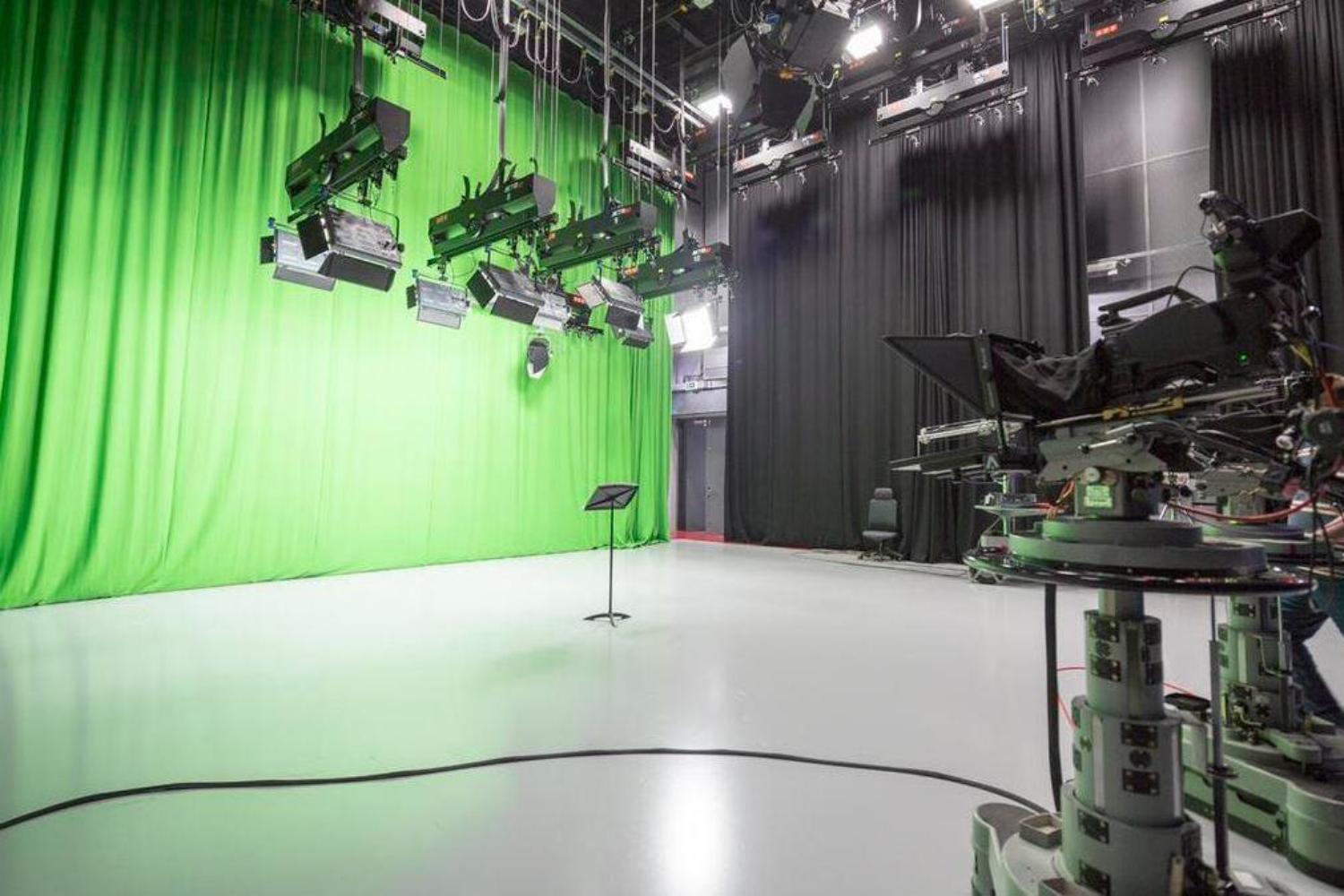 Interior shot of the TV studio with green screen background