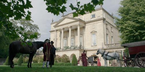The exterior of the Holburne Museum. In front of the museum are actors dressed in regency clothing.