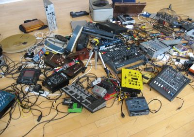 A pile of electronic musical equipment