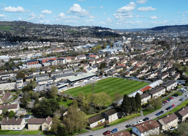 An aerial shot of Twerton Park's football pitch, surrounded by residential housing