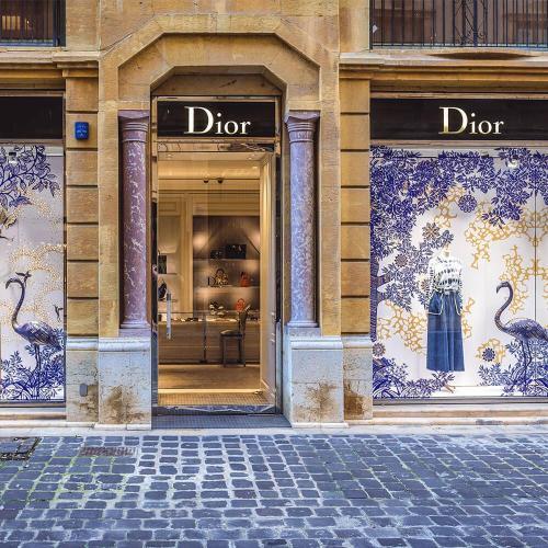 A photo of a Dior shop on a cobbled street