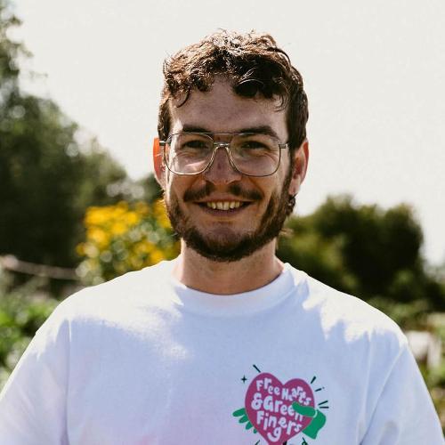 Ed Morrison posing with vegetables he grew at his allotment