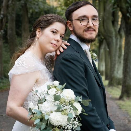 A couple standing together on their wedding day