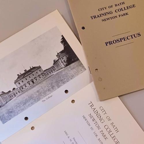 Papers on a table show a photo of Newton Park Main House, and the title page of Newton Park Training College's prospectus from 1948