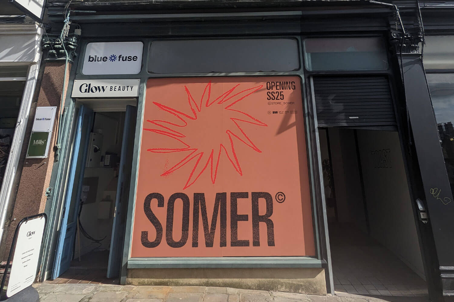 Shop front with the words Somer on the front