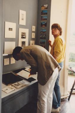 Two men standing by a story board