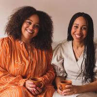 Photo of two sisters smiling at camera