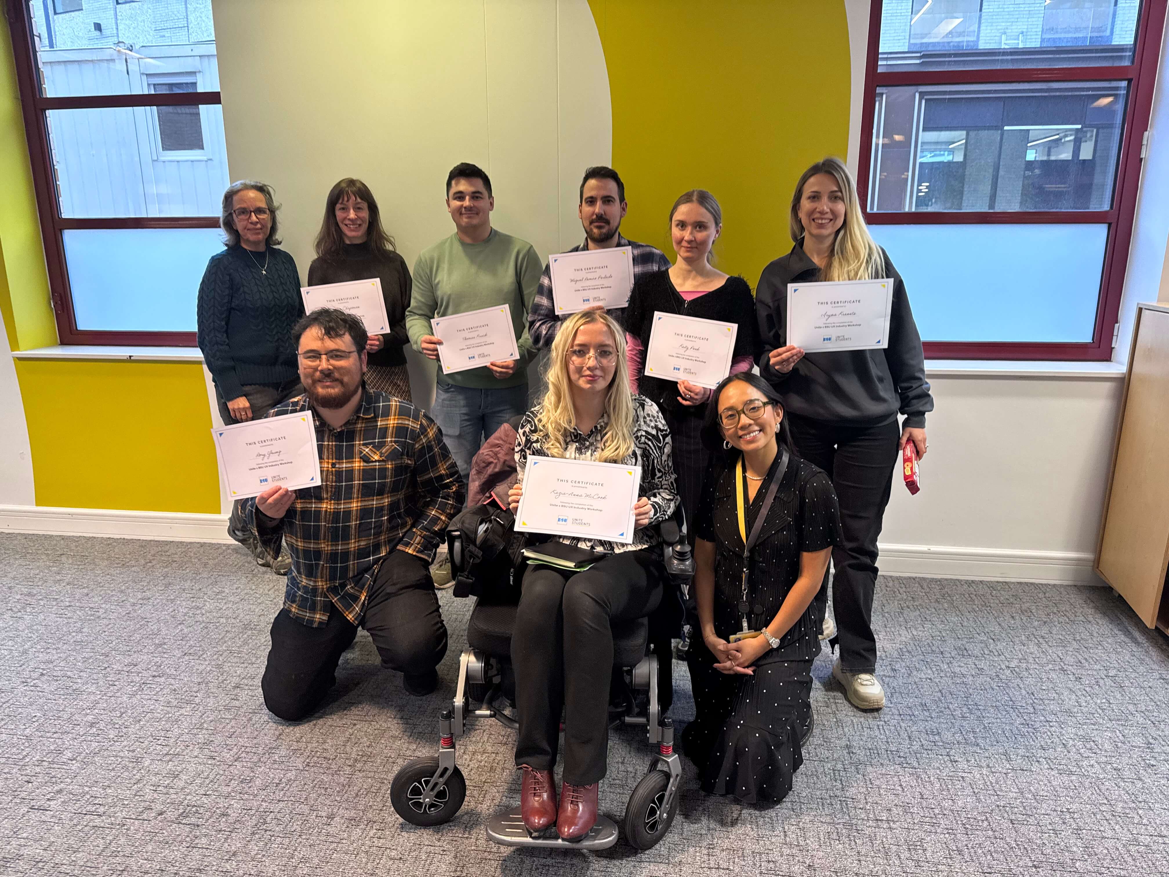 A group of skills bootcamp student holding certificates