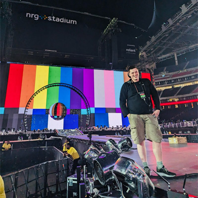 Person on stage in stadium