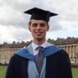 A Bath Spa graduate stands in front of the Royal Crescent