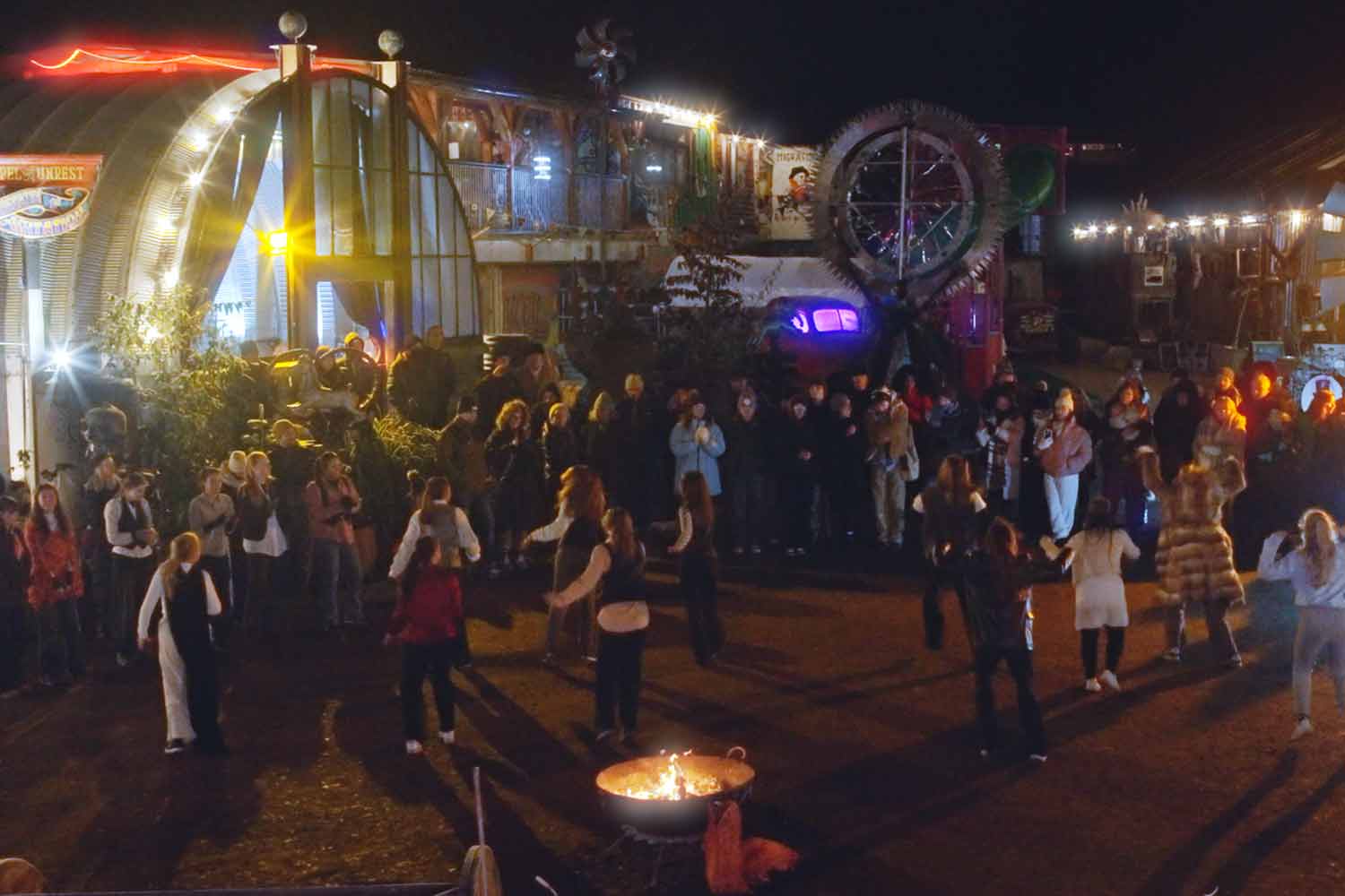 Group of students dancing on industrial site