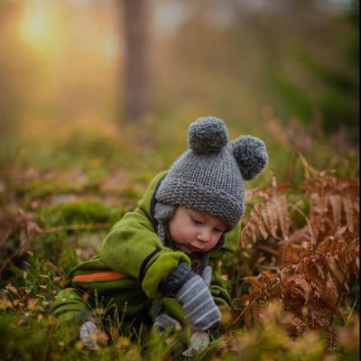 Baby playing in forest