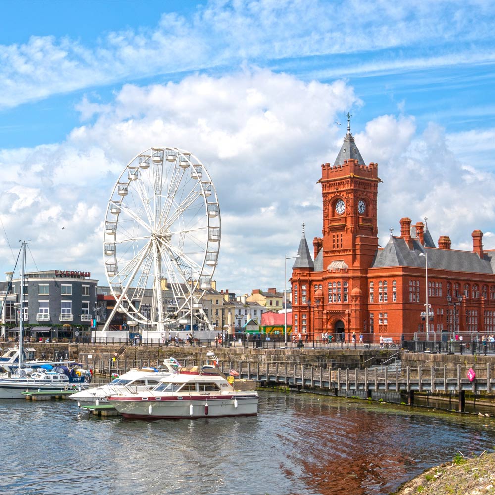 View across Cardiff bay to the city with Cardiff eye and large redbrick building