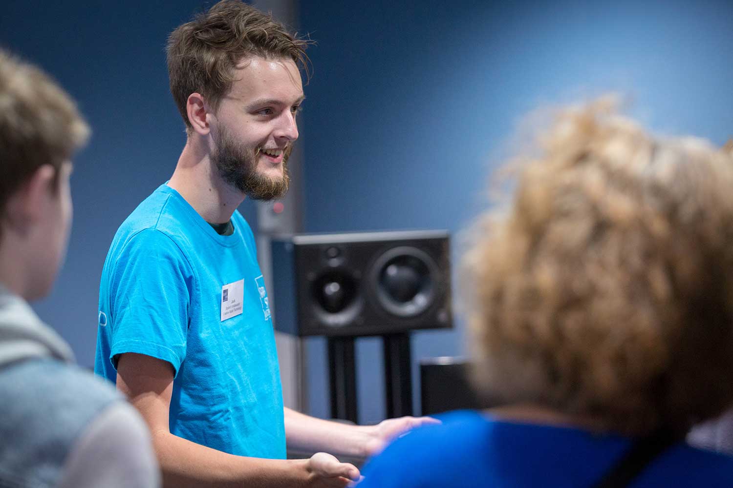 A Student Ambassador talks to prospective students visiting the music facilities