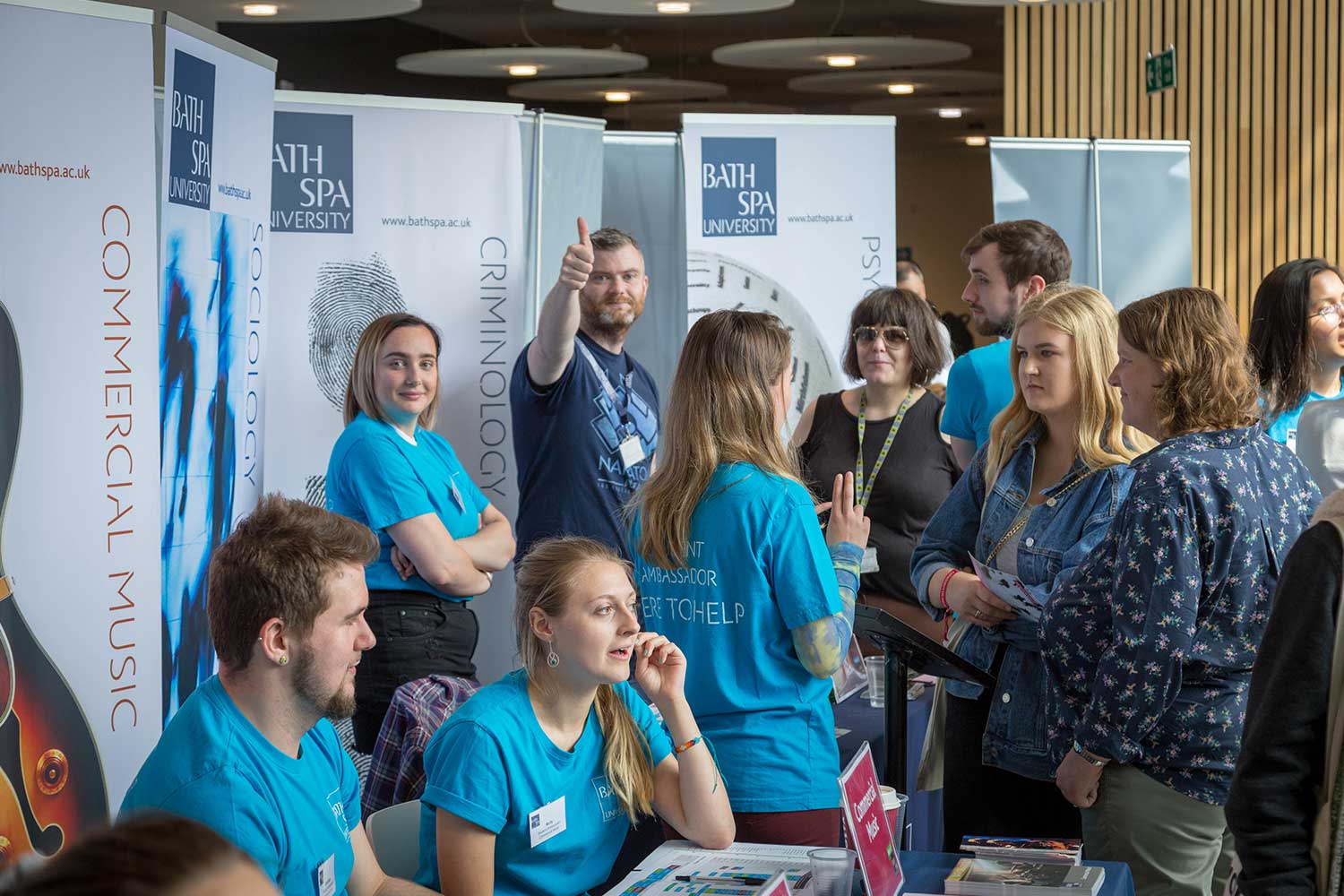 Students Ambassadors and staff gather to speak to visitors at an Open Day