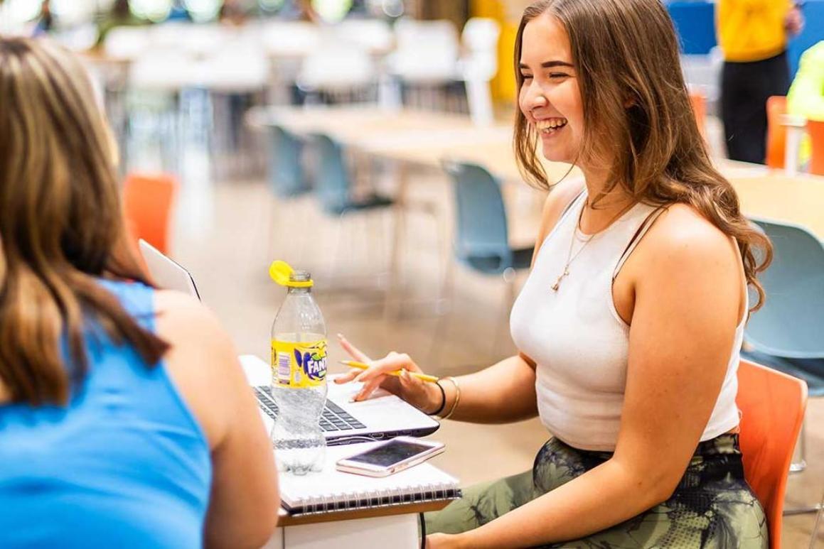 Students sit around a table at Locksbrook Campus