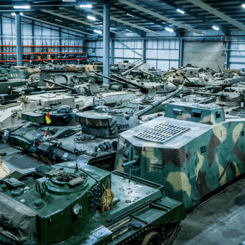 A large collection of tanks in a warehouse.